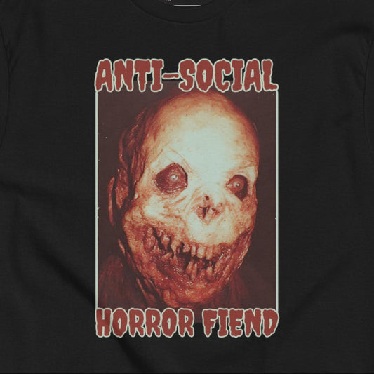 Black Gildan Unisex T-Shirt with 'Anti-social Horror Fiend' text graphic and a scary, monstrous face illustration. 
